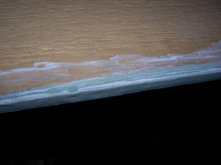 I Mod Podged the backside first, all around the edges, and over the sides.  About 3 coats, and then let it dry for a day or 2